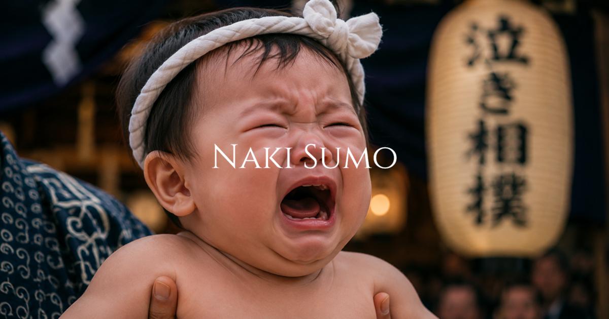 A crying infant wearing a white headband is held during a traditional naki sumo ritual with a blurred lantern and shrine setting in the background.